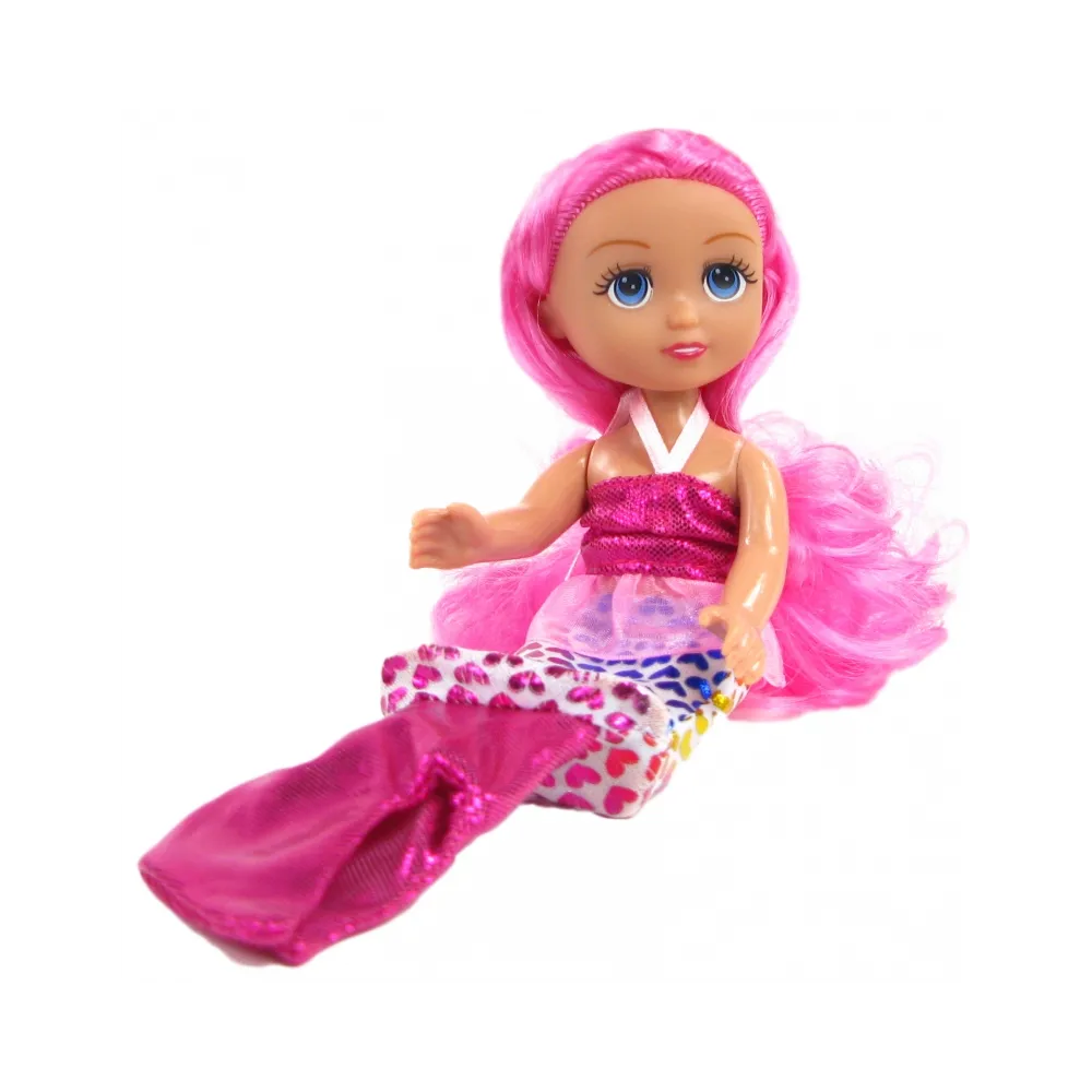 Laleczka w pięknej sukience z długimi włosami do stylizacji.