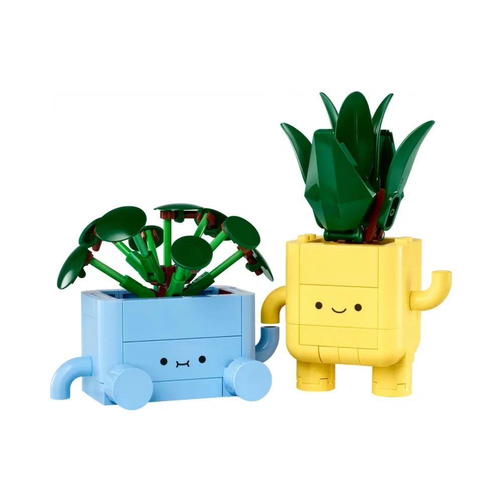 Mała dracena w kolorowej doniczce Lego.