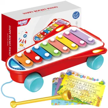 Cymbałki w kształcie czerwonej rakiety kosmicznej na białym tle