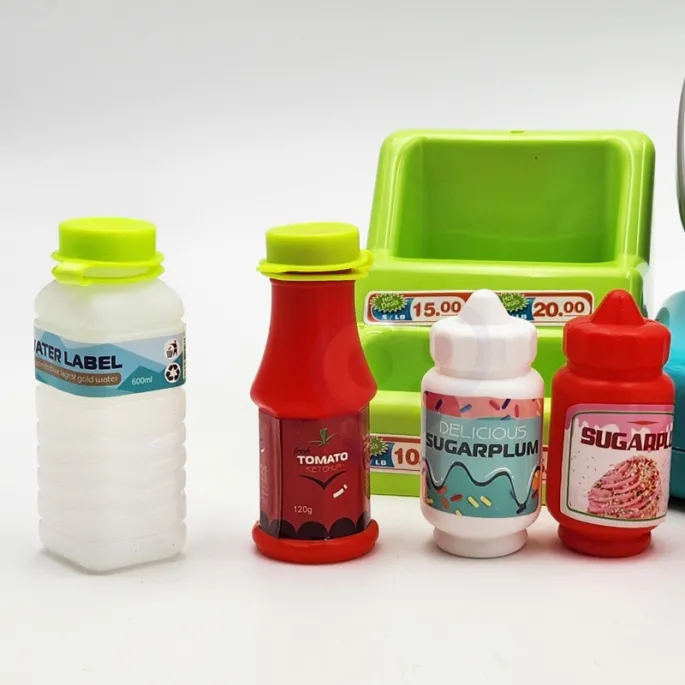 Zestaw z dinozaurem do odgrywania ról w sklepie.