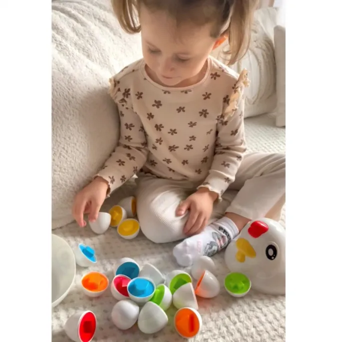 Bezpieczna zabawka edukacyjna z funkcją przechowywania elementów.