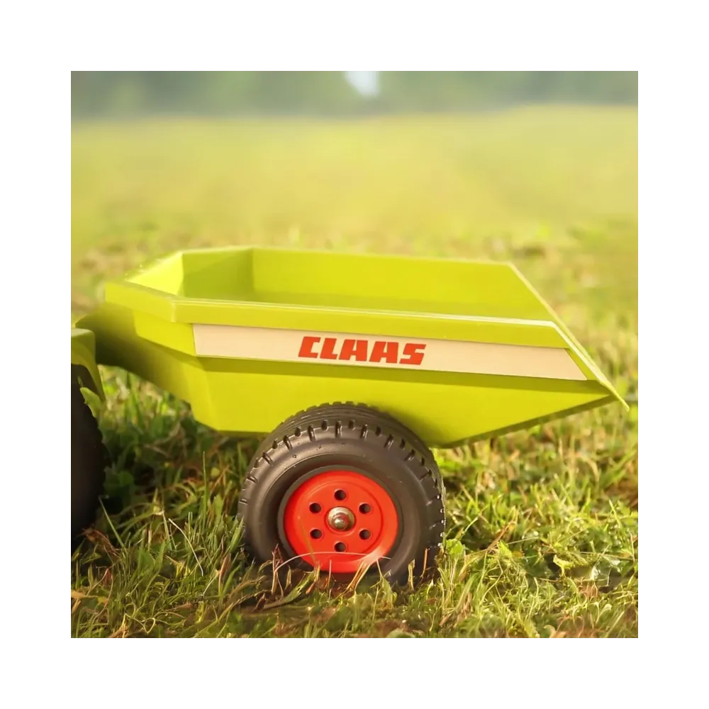 Traktorek FALK z trwałych materiałów, idealny na świeżym powietrzu.