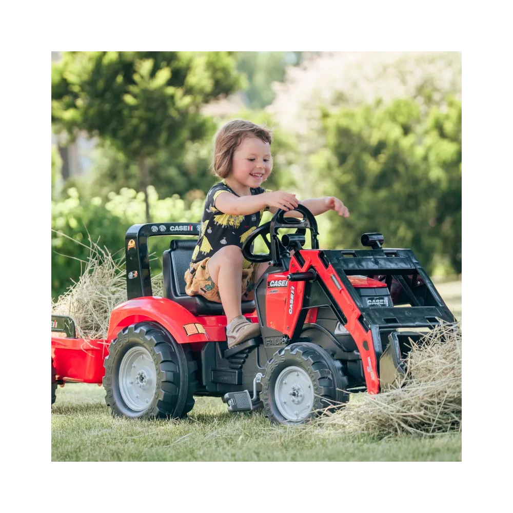 Czerwony traktor z przyczepą do zabawy