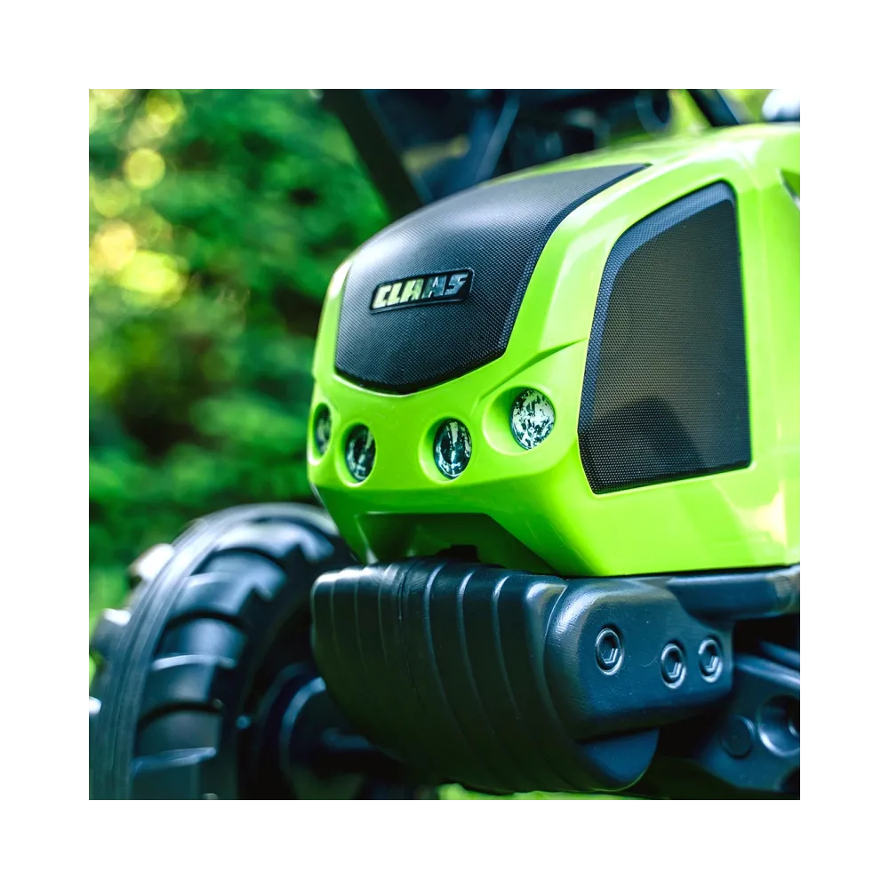 Dziecięcy traktor na pedały z przyczepką idealny do zabawy.