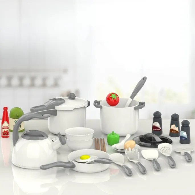 Czajnik i akcesoria kulinarne dla małego kucharza.