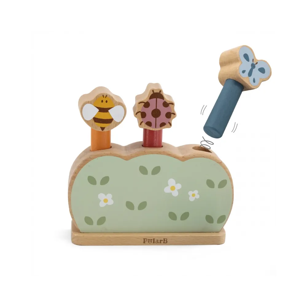 Trzy drewniane skaczące zwierzątka na podstawce w intensywnych kolorach