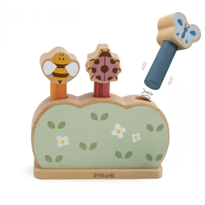 Trzy drewniane skaczące zwierzątka na podstawce w intensywnych kolorach