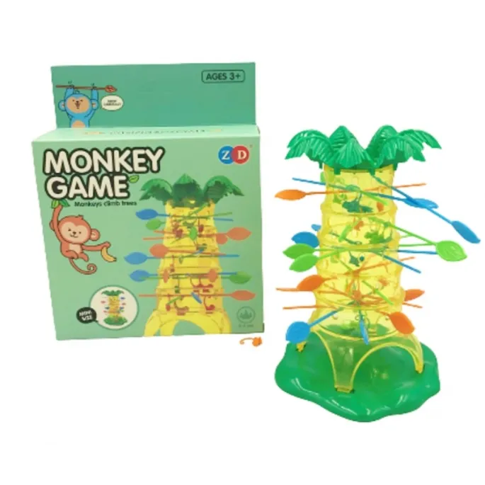 Zbliżenie małpek zawieszonych na patyczkach w grze zręcznościowej.