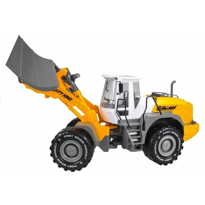 Duży spychacz zabawkowy z ruchomymi elementami podczas zabawy