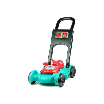 Dziecko bawiące się zestawem ogrodnika na trawie