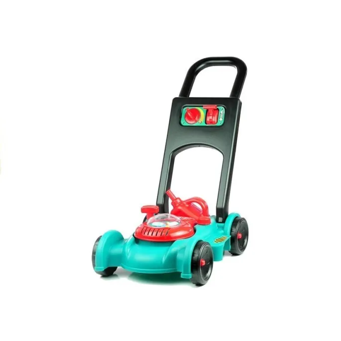 Dziecko bawiące się zestawem ogrodnika na trawie