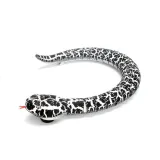 Pilot na podczerwień w kształcie jajka obok zabawkowego węża