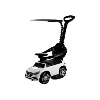 Biały jeździk Mercedes GLE 63 z daszkiem na tle ogrodu