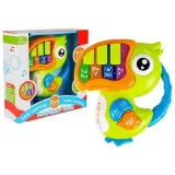 Zielone pianinko organki dziecięce w kształcie papugi z kolorowymi klawiszami