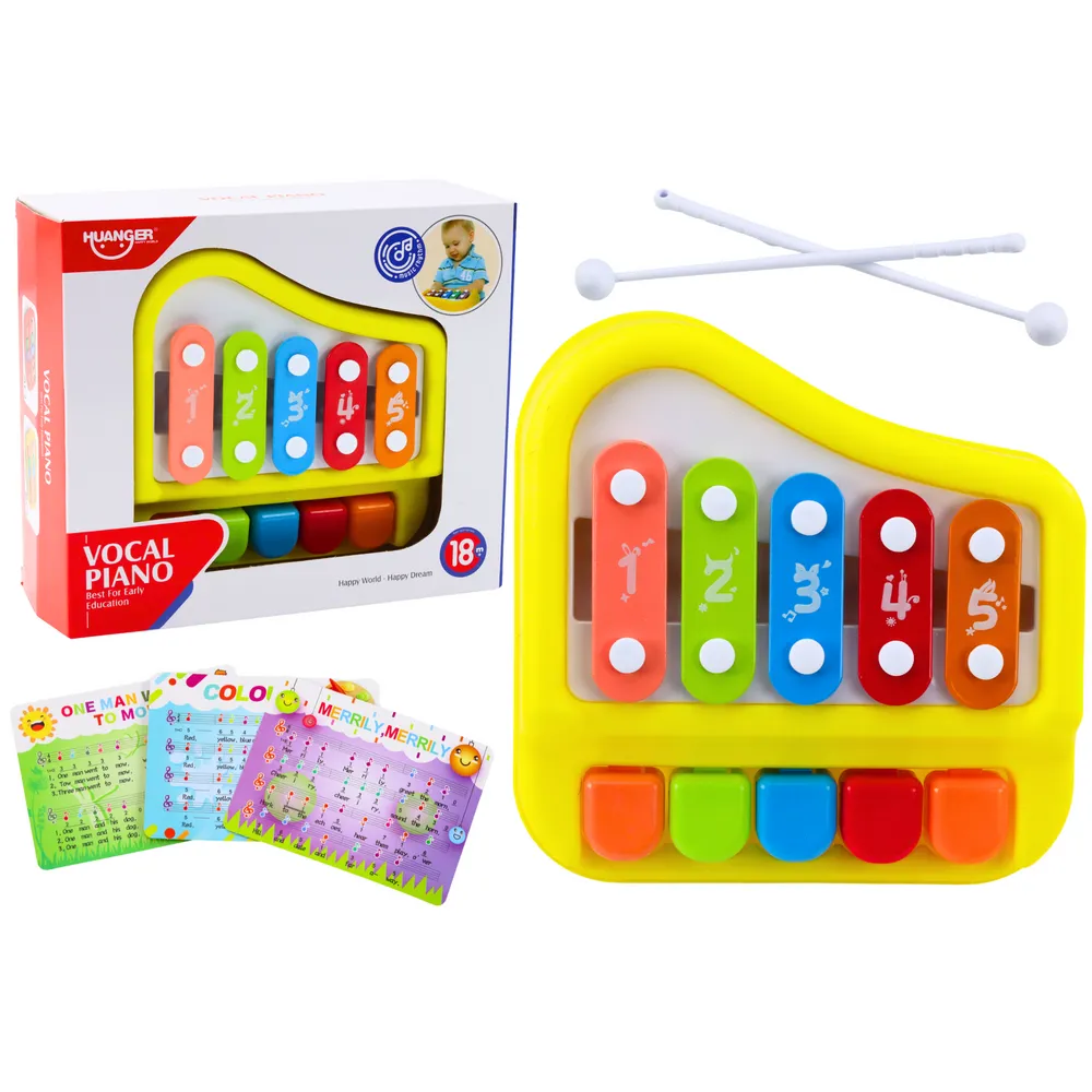 Żółte pianinko cymbałki dzwonki dla dzieci na białym tle