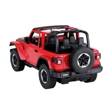 Auto R/C Jeep Wrangler Rubicon z boku na tle terenu