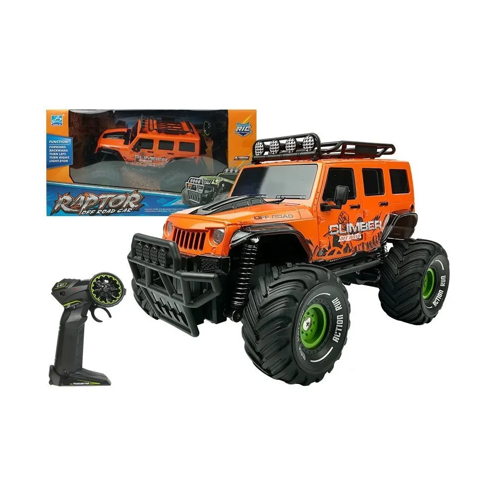 Pomarańczowy jeep terenowy zdalnie sterowany w akcji na kamienistej drodze