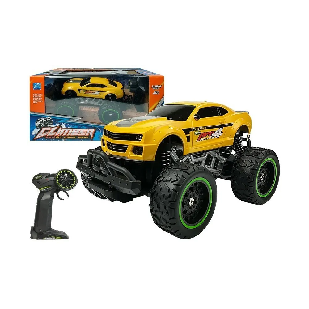 Żółte auto zdalnie sterowane terenowe z wysokimi kołami na trawie