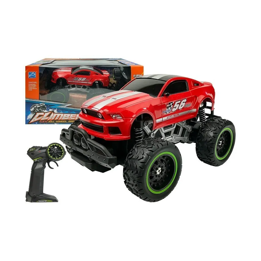 Czerwone auto zdalnie sterowane R/C z wysokimi gumowymi kołami w terenie