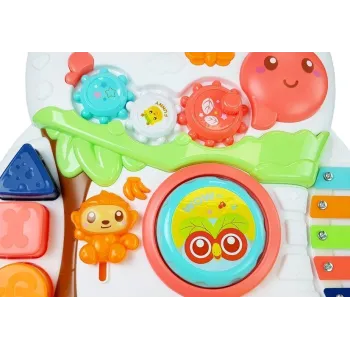 Pchacz z kolorowymi kołami oraz elementami muzycznymi dla malucha