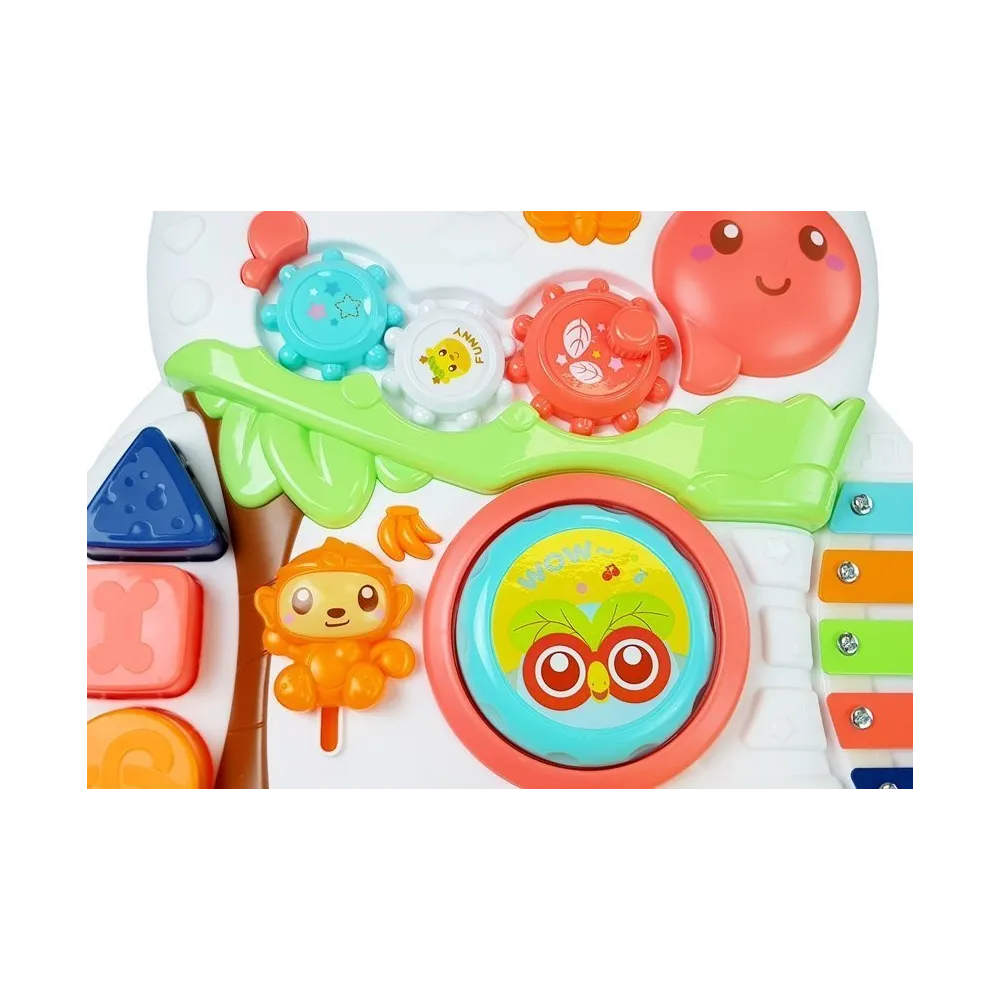 Pchacz z kolorowymi kołami oraz elementami muzycznymi dla malucha