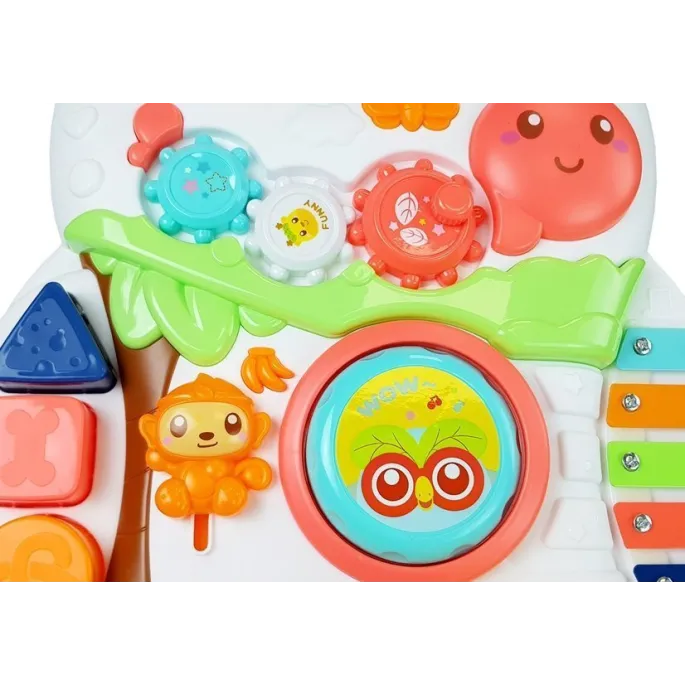 Pchacz z kolorowymi kołami oraz elementami muzycznymi dla malucha