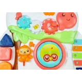 Pchacz z kolorowymi kołami oraz elementami muzycznymi dla malucha