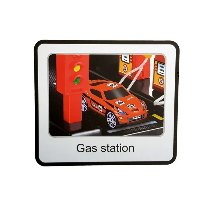 Dziecko bawiące się garażem parkingowym z windą i światłami