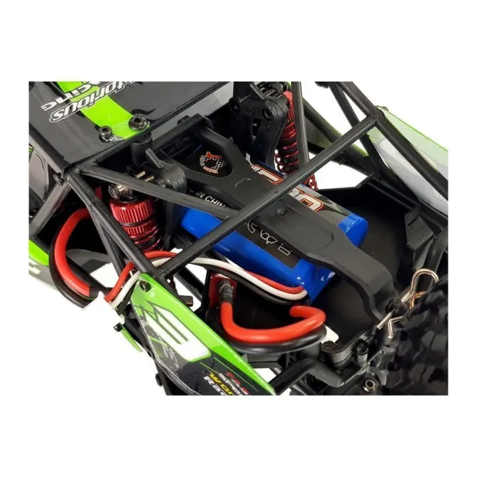 Auto RC FY-03 na trawie demonstruje zawieszenie i amortyzację