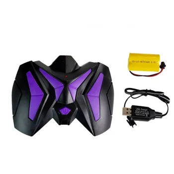 Zestaw: dinozaur RC Tyranozaur, pilot i akumulator na tle pudełka