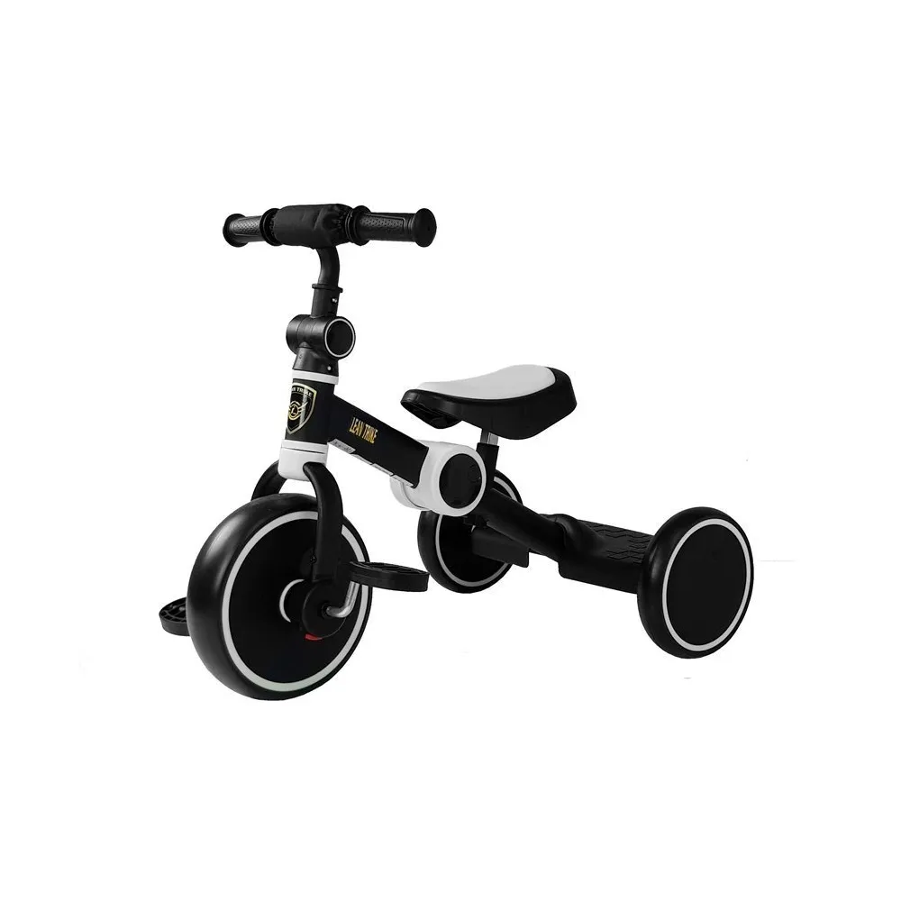 Czarno-biały rowerek trójkołowy na pedały dla dzieci na białym tle