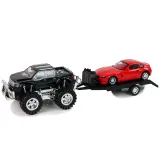 Białe BMW ustawione na lawecie, gotowe do transportu przez Monster Trucka