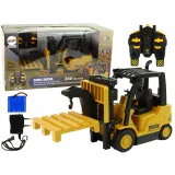 Żółty zdalnie sterowany wózek widłowy dla dzieci z pilotem