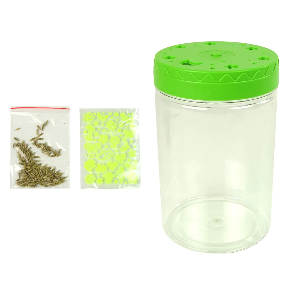 Słoik dekoracyjny z dinozaurami i światłem LED na biurku dziecka