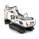 Koparka z gąsienicami i świecącym światłem LED na ramieniu