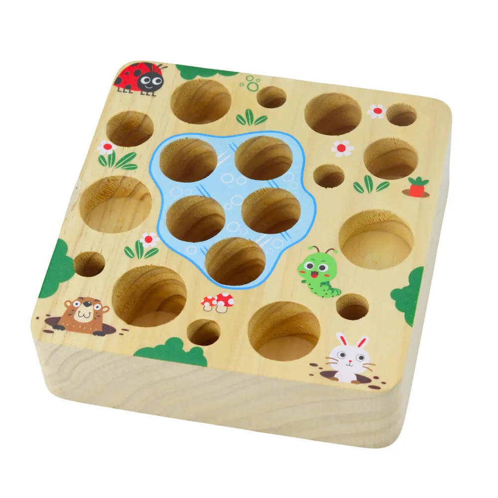 Kolorowe marchewki i magnetyczne dżdżownice do zabawy na drewnianej podstawce