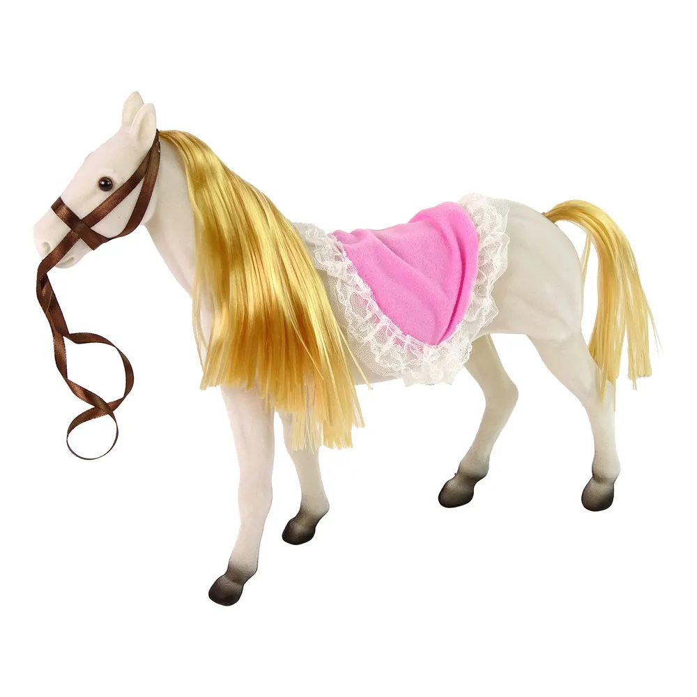 Lalka księżniczka w eleganckiej sukience stojąca przy kucyku