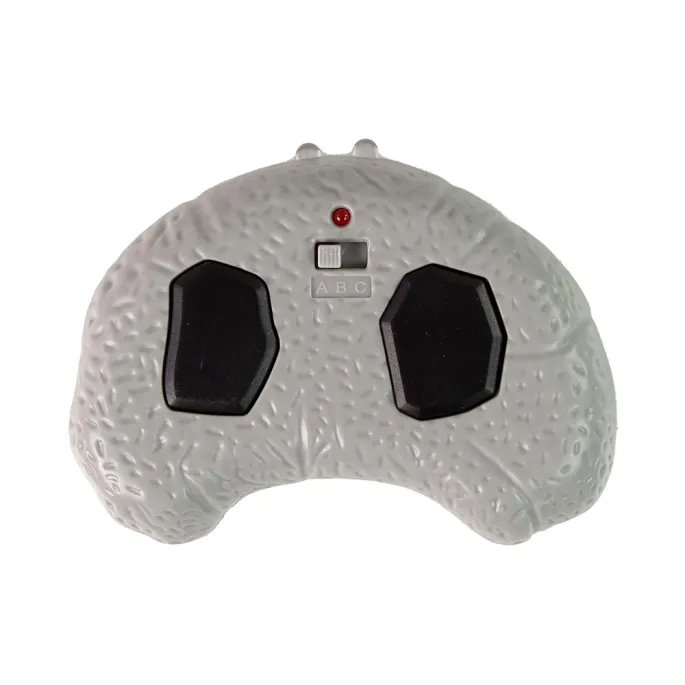 Zabawka dinozaur z czerwonymi, świecącymi oczami