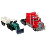 Koparka z przyczepą z zestawu R/C na tle budowlanych akcesoriów