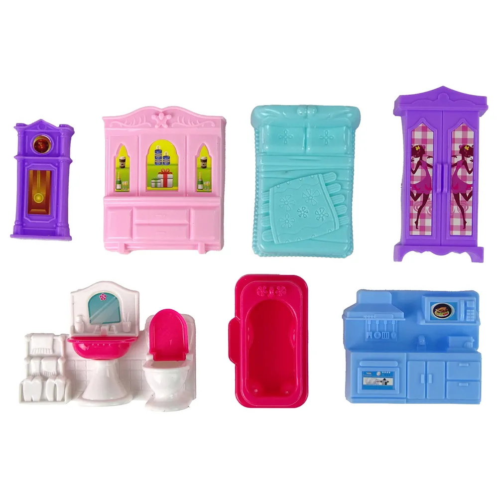 Zbliżenie na szczegóły różowego domku dla lalek i wyposażenia