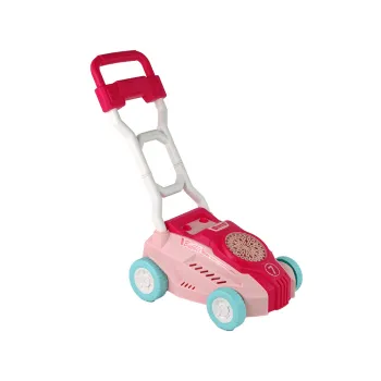 Różowa zabawka wydmuchująca bańki na tle zielonej trawy