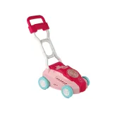 Różowa zabawka wydmuchująca bańki na tle zielonej trawy