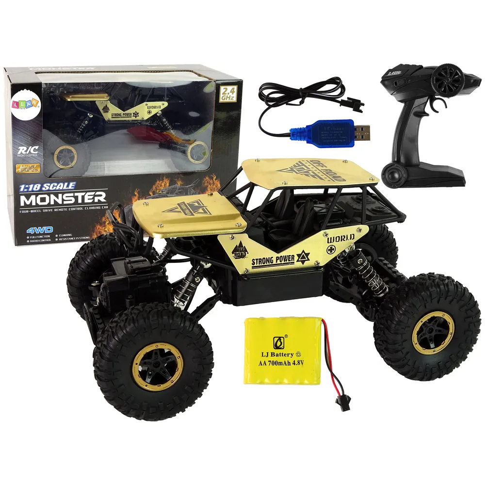 Auto RC z wysokimi kołami w wersji czarno-złotej podczas jazdy off-road