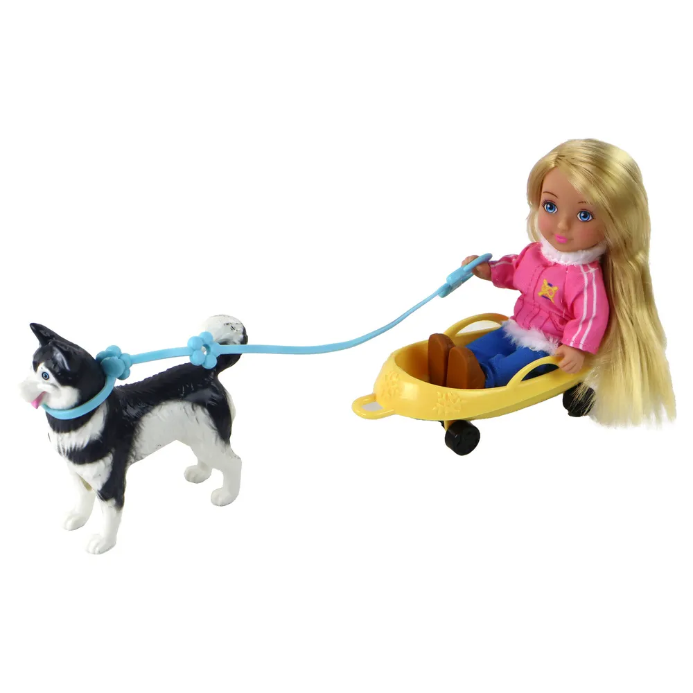 Piesek husky na niebieskiej smyczy obok lalek