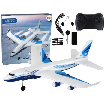 Biały zdalnie sterowany samolot RC 4D-G2 podczas lotu z włączonymi światłami LED