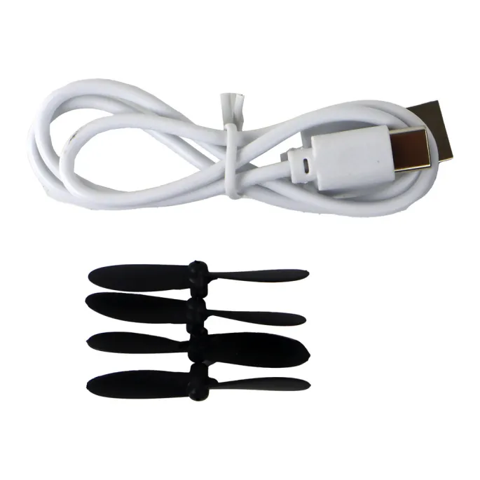 Zestaw samolotu myśliwca R/C i elementów ładowania na białym tle