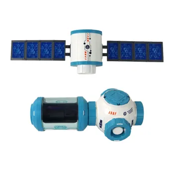 Dziecko bawiące się zestawem rakietą i stacją kosmiczną