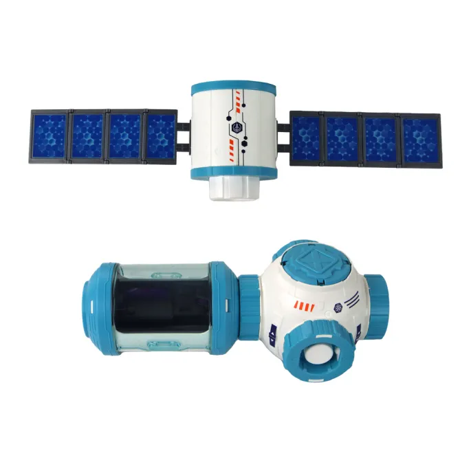 Dziecko bawiące się zestawem rakietą i stacją kosmiczną