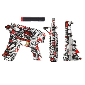 Zbliżenie na designerski elektryczny karabin na żelowe kulki w graffiti