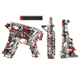 Zbliżenie na designerski elektryczny karabin na żelowe kulki w graffiti